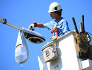 Lineman Repairing a Light