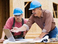Construction Workers at a Computer