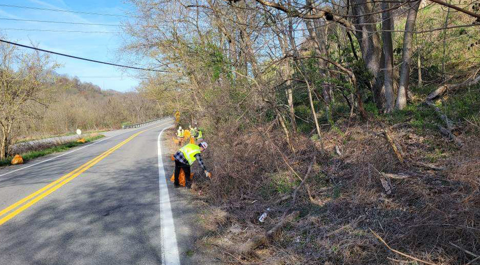 Mon Power employees cleaning highway