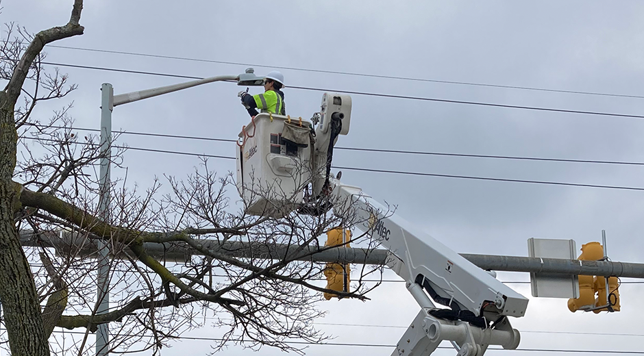 Lineman installing LED Streetlights