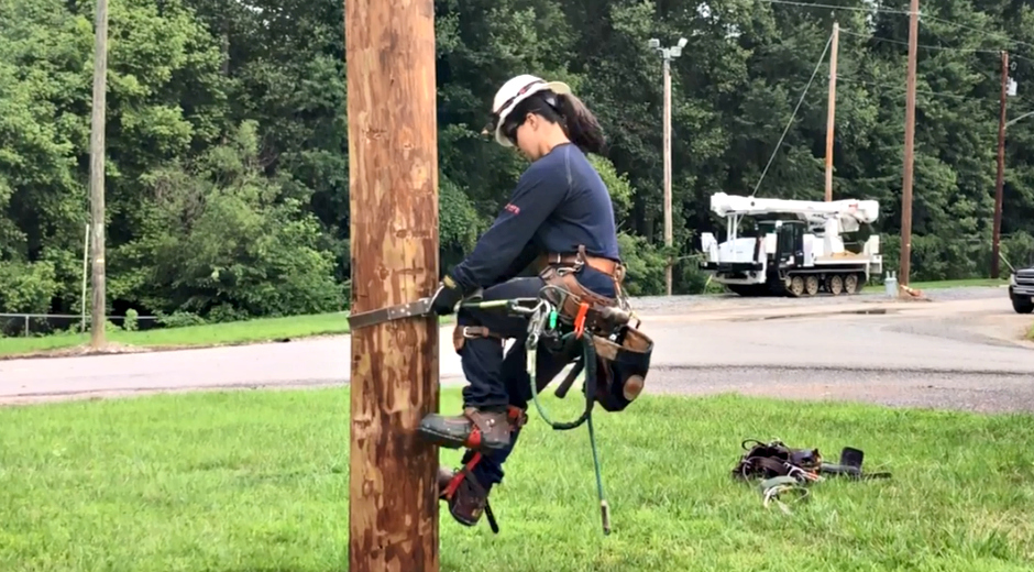 ashley morris climbing a pole