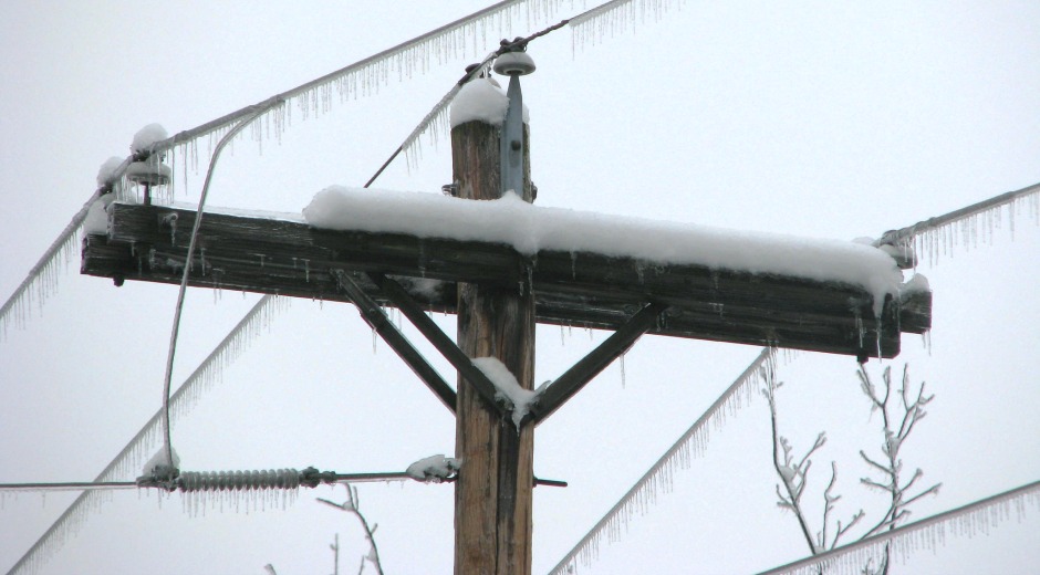 snow covered utility pole