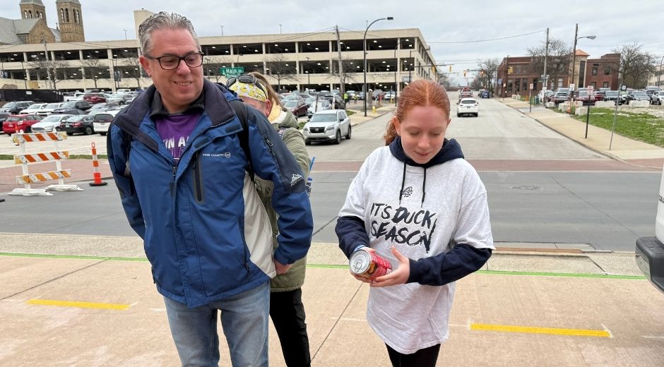 Father and daughter at food drive