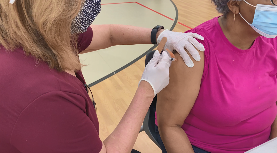 Vaccination Shot Administered Into Arm Of Woman.